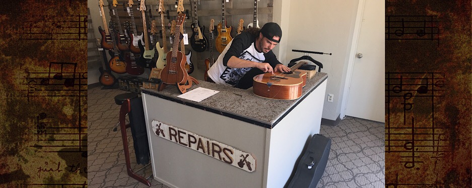 Repair Station Jared adding new Guitar Strings